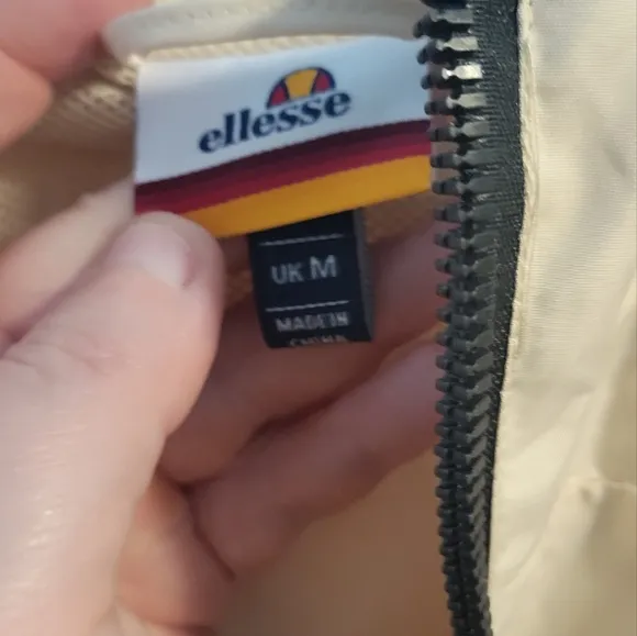 Ellesse Utility Jacket in Cream with Red and Black Patch
